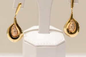 SHIMMER SEASON: DESIGNERS REINVENT STATEMENT PIECES FOR SUMMER